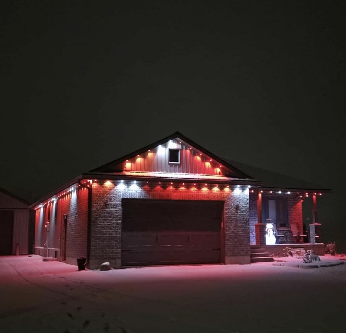 Apex Exteriors permanent LED lighting - red and white holiday display