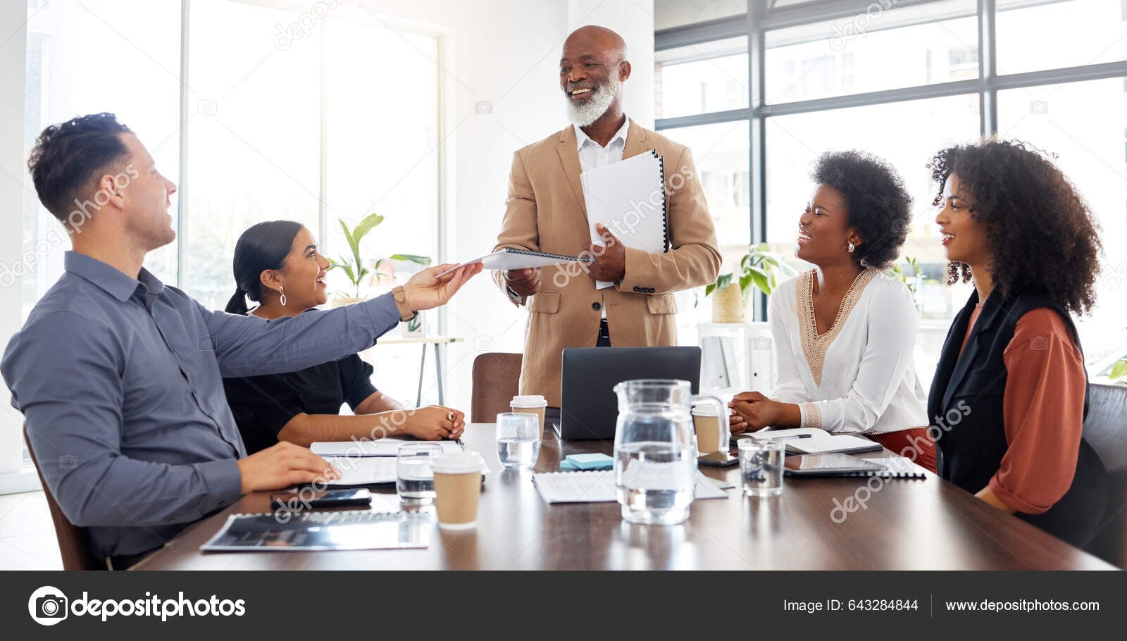 Business team reviewing financial documents in meeting