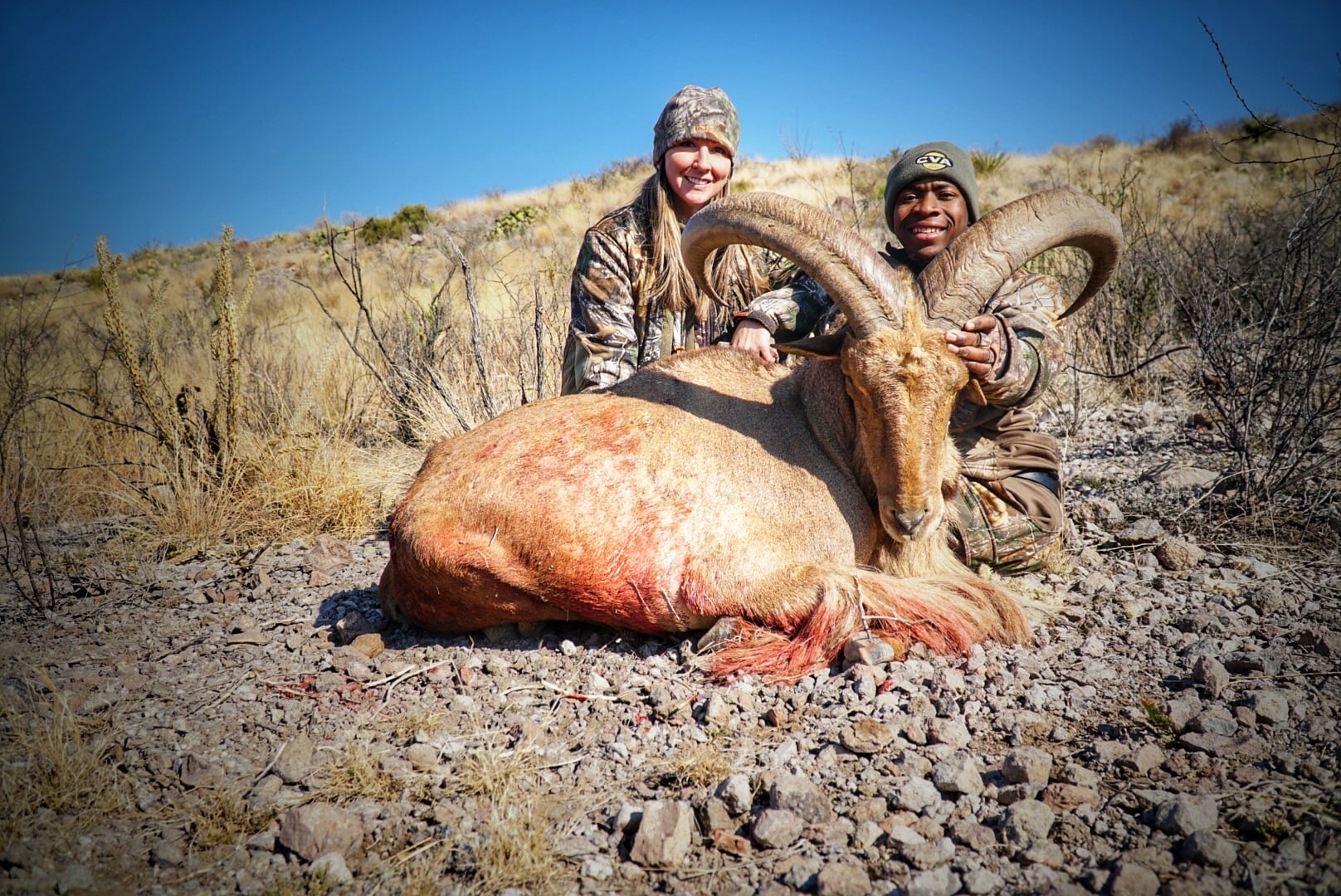 Joshua and hunting partner with an aoudad sheep in the West Texas desert