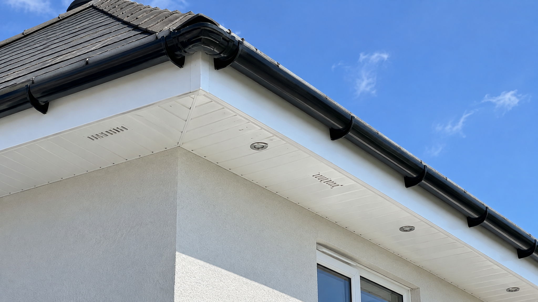 Clean white fascia boards and soffits on an Irish house